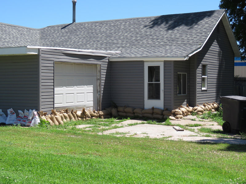 Sandbags line a house in Gibbon